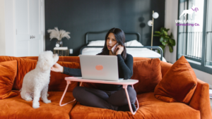 Pet service owner reviewing their website on a laptop, highlighting the importance of online presence for business growth